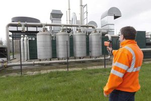 Field technician using SR-LD laser detector for methane leak inspection